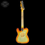 Electric guitar with a sunburst finish on a black background, featuring the Tone Shop logo.
