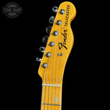 Fender Telecaster guitar headstock on a black background