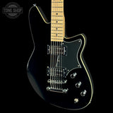 A black electric guitar with a maple neck, chrome hardware, and gold binding, shown against a black background with a Tone Shop watermark in the top left corner.