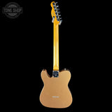 Electric guitar with a blonde finish on a black background, featuring the Tone Shop logo.
