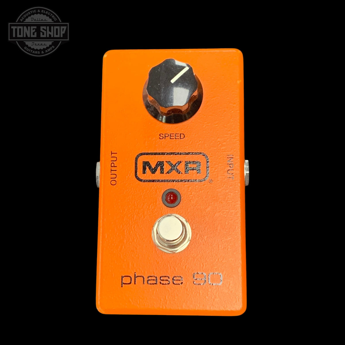 Orange MXR phase 90 guitar effects pedal with a black background