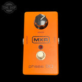 Orange MXR phase 90 guitar effects pedal with a black background