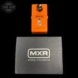 Orange MXR guitar effects pedal on a black background with MXR branded box below.