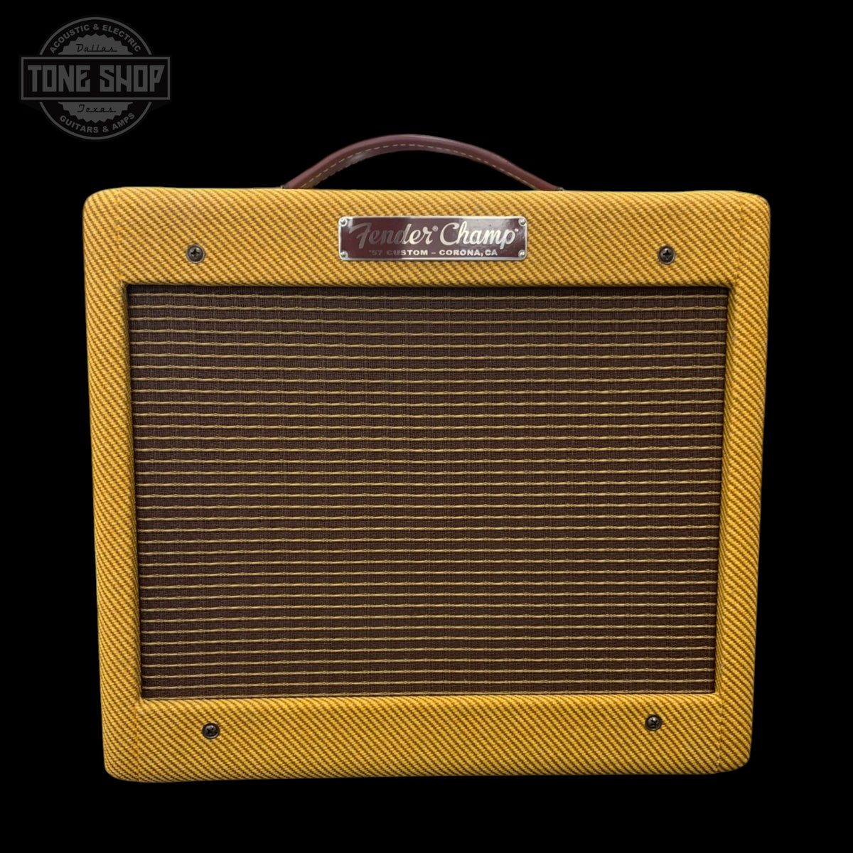 Yellow Fender Champ guitar amplifier with tweed front panel on a black background