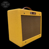 Yellow amplifier with a tweeter grille on a black background, featuring the Fender logo.