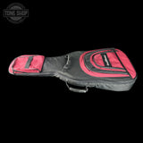 A black and red guitar gig bag with a main body compartment, a smaller side pocket, and a top zippered pocket, shown against a solid black background. A Tone Shop watermark is visible in the top left corner.