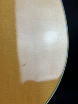 Close-up of a guitar soundboard with a dark background