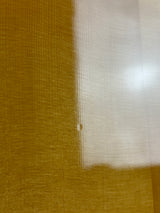 Close-up of a textured brown surface with a white patch
