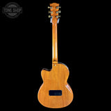 Back view of a wooden electric guitar with 'Tone Shop' logo in the corner.