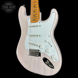 A classic Fender Stratocaster electric guitar in a glossy white finish, featuring a maple neck and a white pickguard, shown against a solid black background with a Tone Shop watermark in the top left corner.