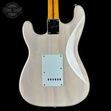 The back of a Fender Stratocaster electric guitar in a glossy white finish, featuring a maple neck and a black Tune Shop logo overlay in the top left corner.