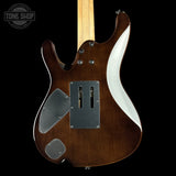 A close-up of the back side of an electric guitar body, showing a dark brown wood finish, a white side profile accent, chrome hardware, and a maple neck against a black background.