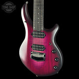 A modern electric guitar with a vibrant magenta-to-purple sunburst finish, shown against a solid black background. The brand logo in the top-left corner reads 'TONE SHOP'.