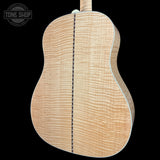 Close-up of a guitar's back with a visible brand logo in the corner.