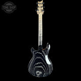 A double-cutaway electric guitar with a black and white swirling wood grain finish, shown against a solid black background. A Tone Shop logo is visible in the top-left corner.