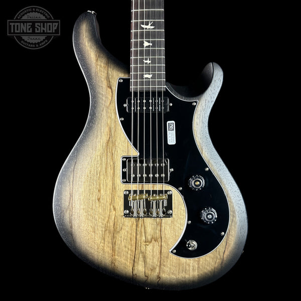 Electric guitar with a wood finish on a black background, featuring the Tone Shop logo.