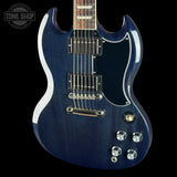 A blue Gibson SG electric guitar with a glossy dark blue finish, chrome hardware, and a black pickguard, shown against a solid black background with a Tone Shop watermark in the top left corner.