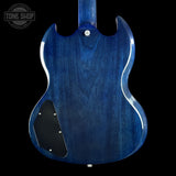 The back of a blue electric guitar with a glossy blue finish, black pickguard, and white binding, shown against a black background with a Tone Shop watermark in the top left corner.