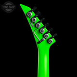 Close-up of the headstock of an electric guitar in bright neon green, showing six black tuning pegs with silver rings against a solid black background. A Tone Shop watermark is visible in the top-left corner.