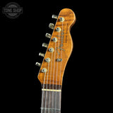 Fender guitar headstock on a black background with 'Tone Shop' logo.