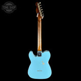 Electric guitar with a turquoise body and brown neck on a white background