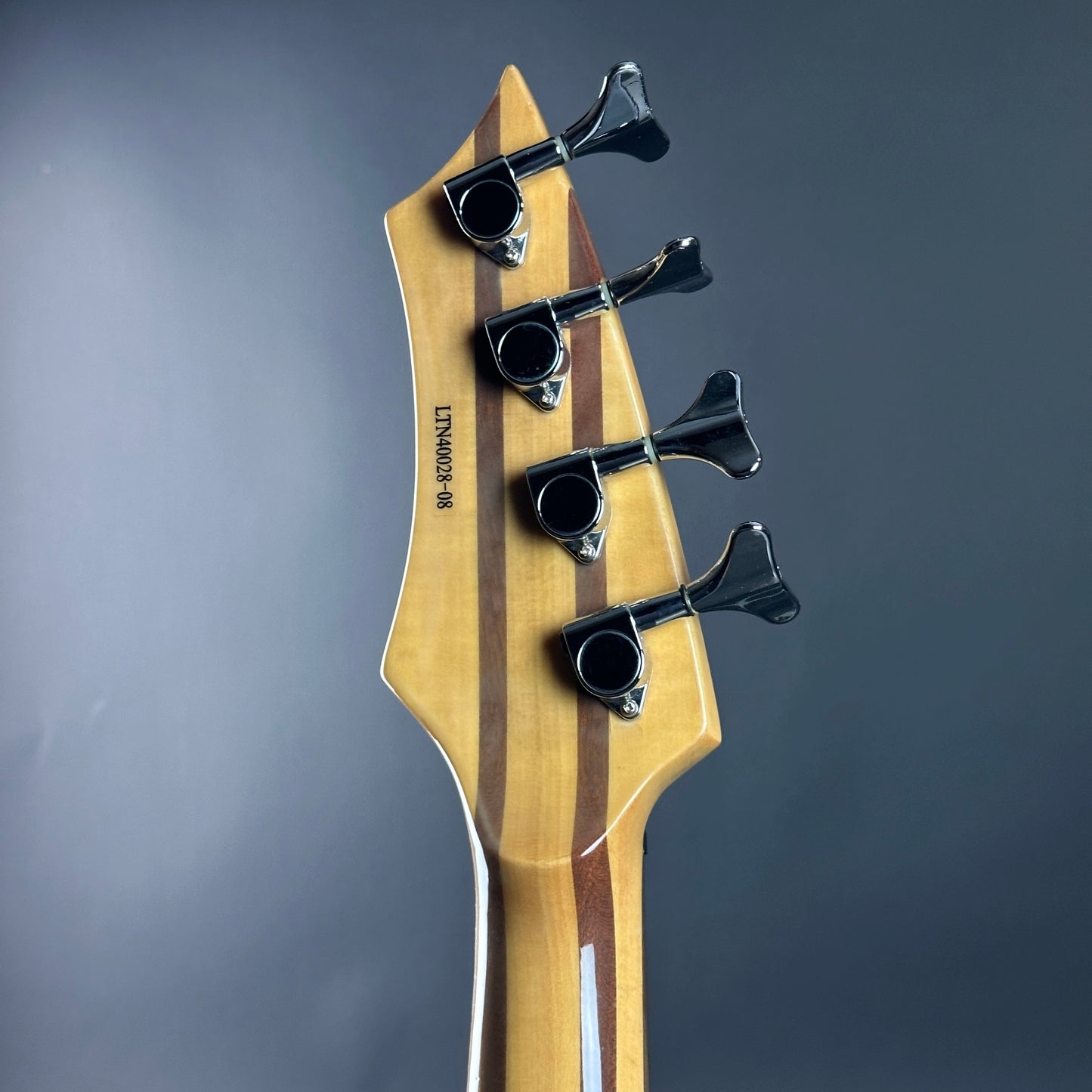 Back of headstock of Used Lace Helix Bass Red.