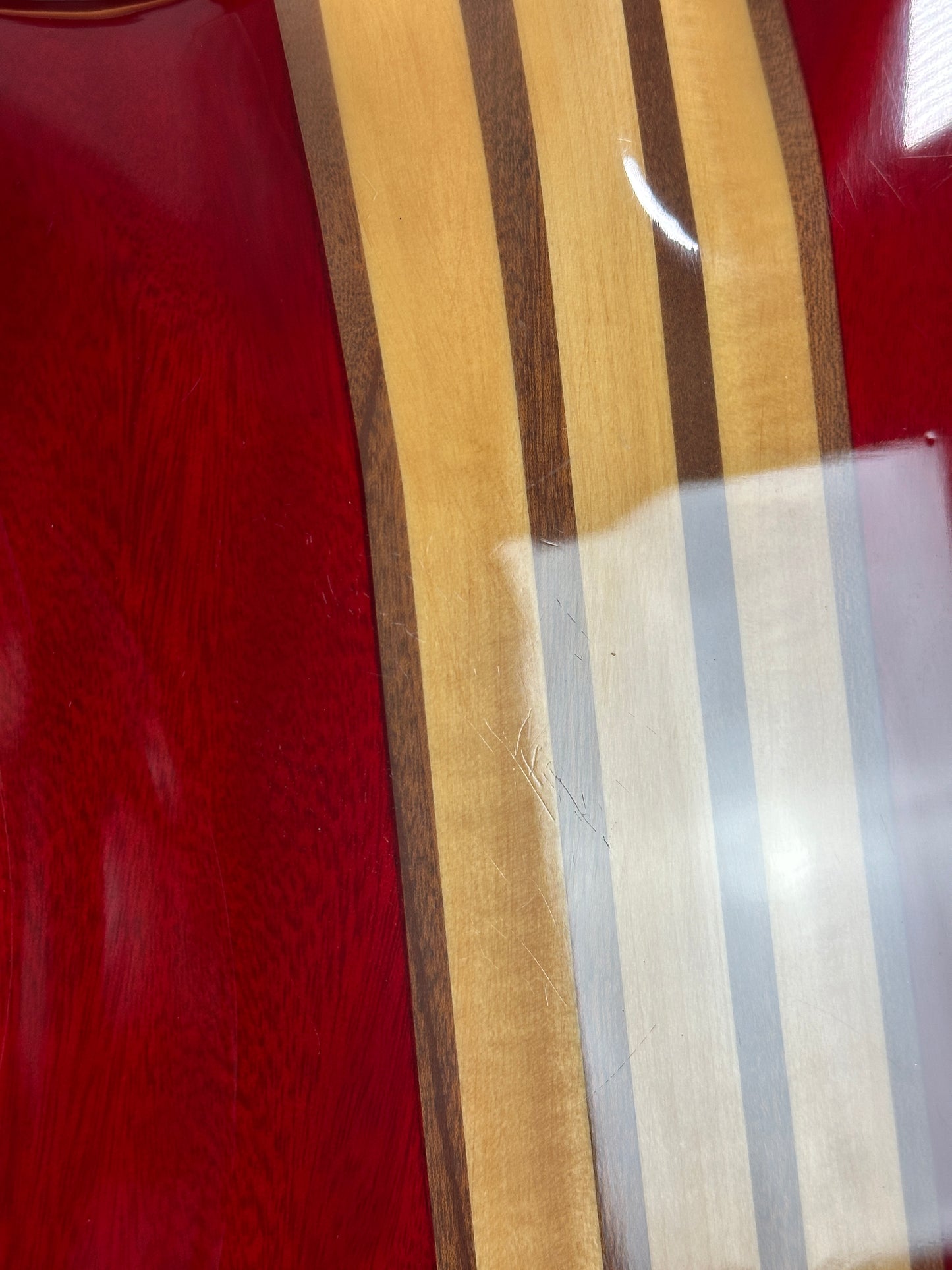 Scratches on back of Used Lace Helix Bass Red.