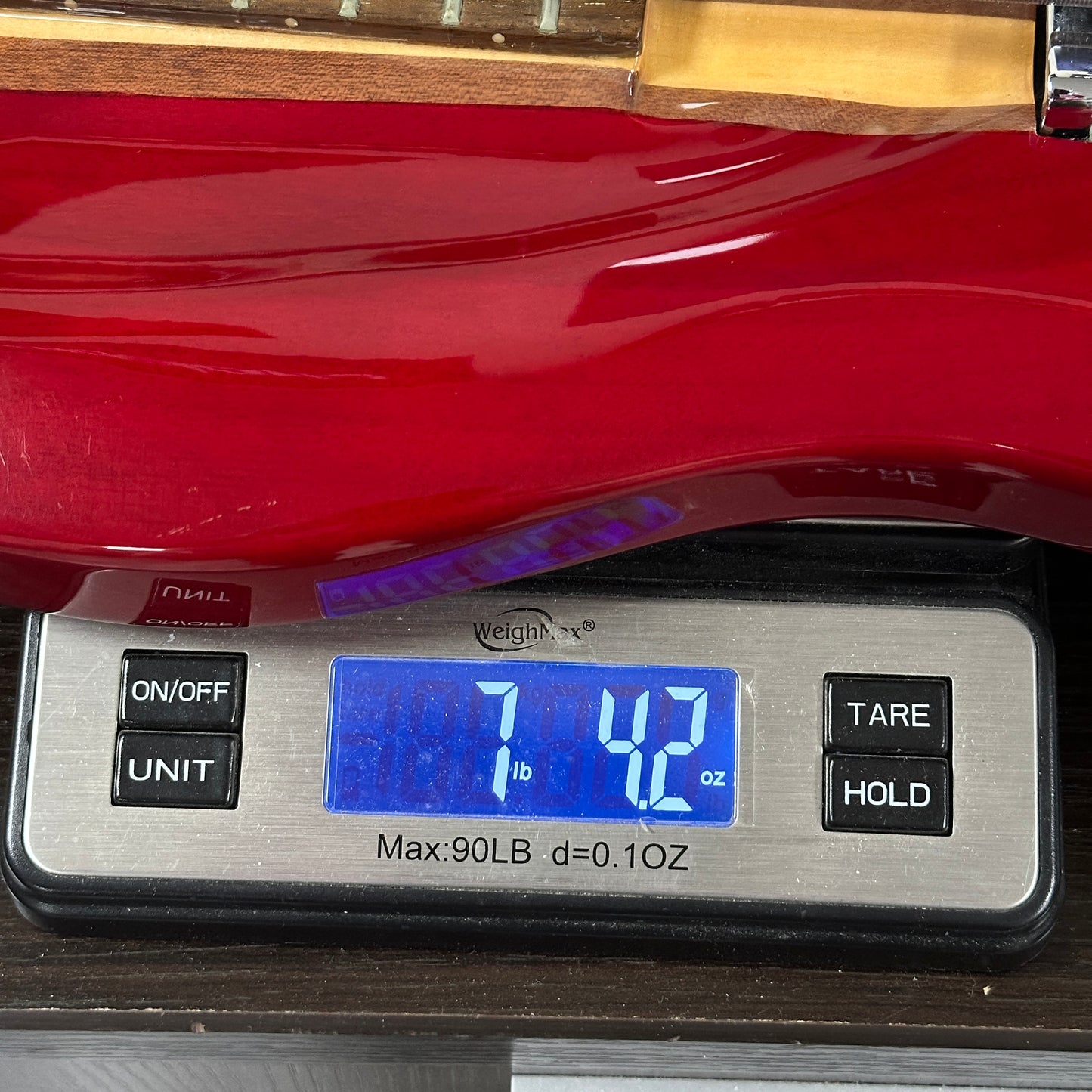 Used Lace Helix Bass Red on scale displaying weight.