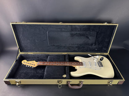 Electric guitar in a open case on a gray background