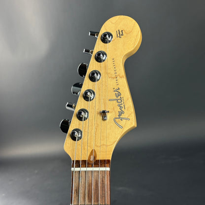 Fender guitar headstock on a gray background