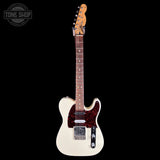 A classic Fender Telecaster-style electric guitar with a cream-colored body, a black and red speckled pickguard, and a maple neck, shown against a solid black background. A 'TONE SHOP' watermark is visible in the top-left corner.