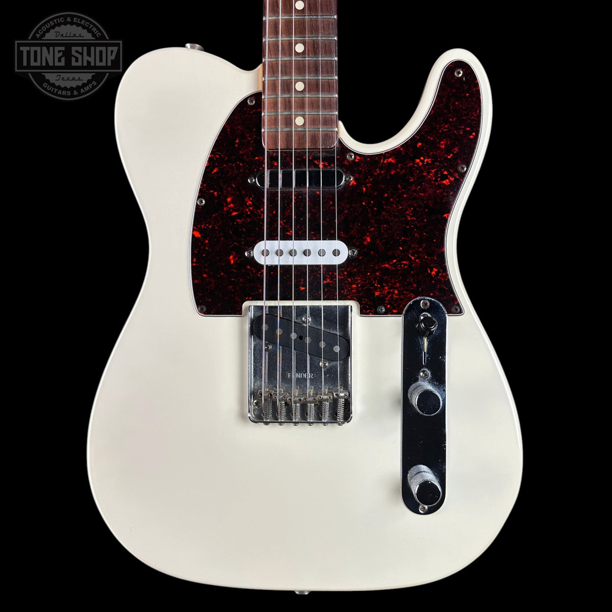 A classic Fender Telecaster electric guitar with an off-white body, a red glitter pickguard, and chrome hardware, shown against a solid black background.