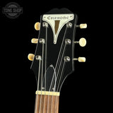 Close-up of a guitar headstock with Epiphone logo on a black background