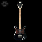 Electric guitar with a black finish on a white background