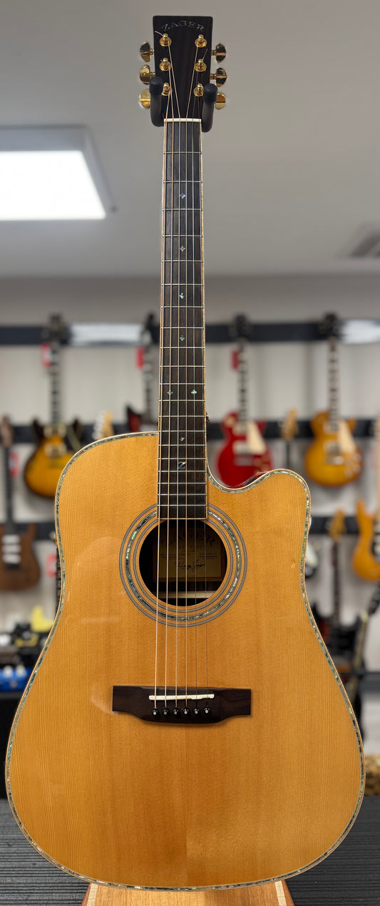Acoustic guitar on display in a music store with other guitars in the background