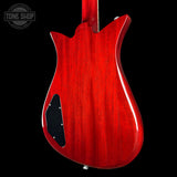 Red electric guitar body with a visible brand logo in the corner.
