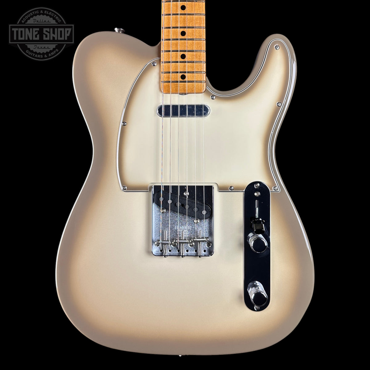 A classic Fender Telecaster electric guitar in a cream-to-brown sunburst finish, featuring a maple neck, chrome hardware, and a black control plate, shown against a solid black background with a Tone Shop watermark.