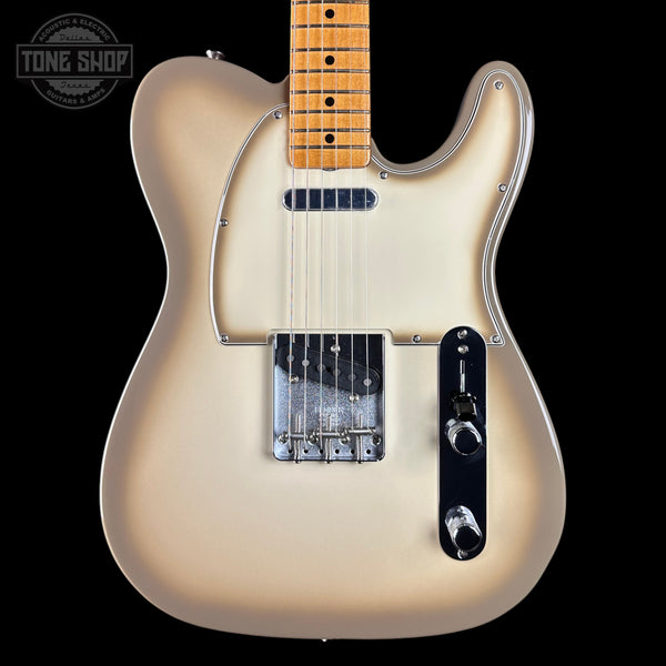 A classic Fender Telecaster electric guitar in a cream-to-brown sunburst finish, featuring a maple neck, chrome hardware, and a black control plate, shown against a solid black background with a Tone Shop watermark.