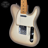 A classic Fender Telecaster-style electric guitar with a cream-colored body, maple neck, and black hardware, shown against a solid black background with a Tone Shop watermark in the top-left corner.