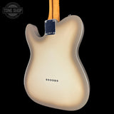 Rear view of an electric guitar body in a cream-to-brown sunburst finish, with a maple neck and chrome hardware, shown against a black background.