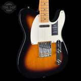 Fender Telecaster electric guitar body in a sunburst finish, featuring a white pickguard, chrome hardware, and a maple neck, shown against a black background with a Tone Shop watermark.