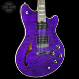 A purple flamed maple electric guitar with chrome hardware, shown against a solid black background with a Tone Shop watermark in the top-left corner.