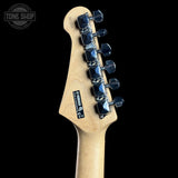 Guitar headstock with tuning pegs on a black background, featuring the Tone Shop logo.
