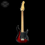 Electric guitar with a red body and black pickguard on a white background