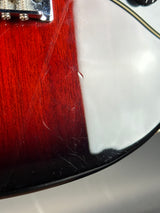 Close-up of a banjo's headstock and wooden body