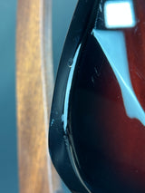 Close-up of a car's side mirror with a blurred background