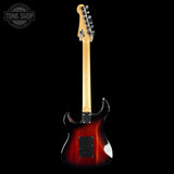 Electric guitar with a red sunburst finish on a black background, featuring the Tone Shop logo.
