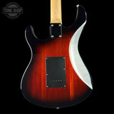Electric guitar with a flame pattern on a black background, featuring the 'Tone Shop' logo.