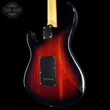 Electric guitar with a sunburst finish on a black background, featuring the Tone Shop logo.