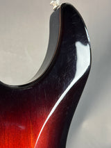 Close-up of a guitar's pickguard with a gradient finish.